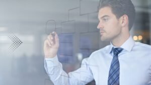 Men drawing organizational chart on glass