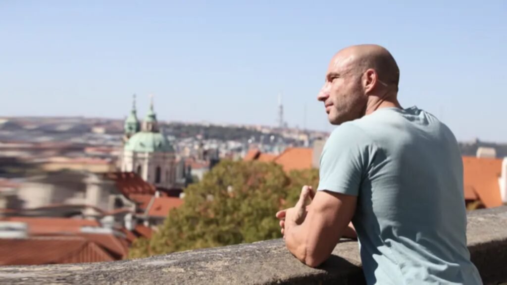 Pascal Bachmann, founder and CEO of Strategy Achievers, looking out over a European old town